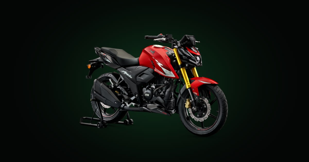 TVS Apache RTR 160 4V vermelha sobre fundo escuro com brilho verde