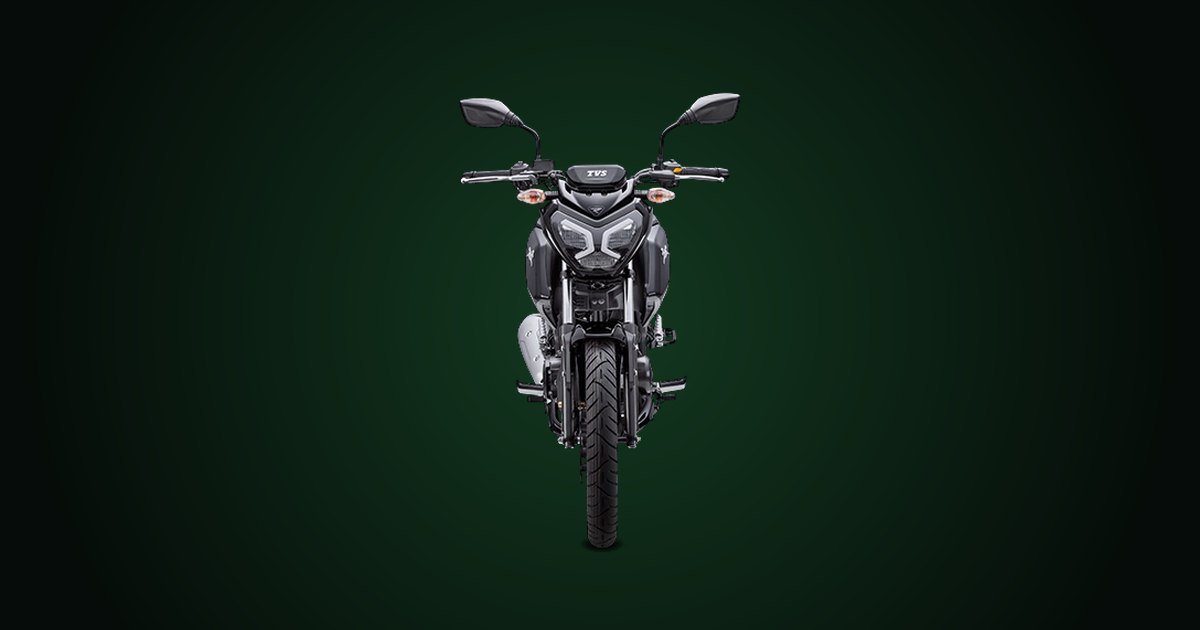 TVS Raider 125 preta vista de frente, com o farol de LED em destaque, sobre fundo verde-escuro